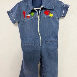 Vintage bell bottom one piece with train appliqué